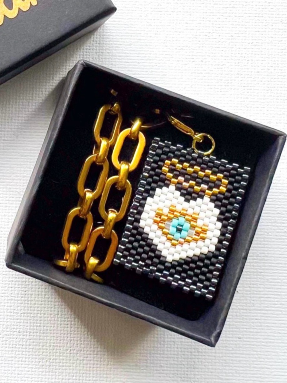 Guardian Evil Eye Charm on Chunky, Stainless Steel Necklace. Black, gold, white.